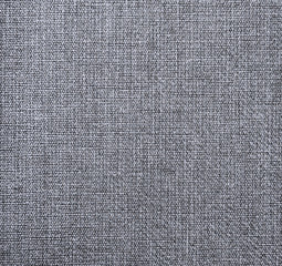 Fototapeta na wymiar Textured gray natural fabric . 