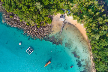 Amazing island with sand beach green tree forest aerial view