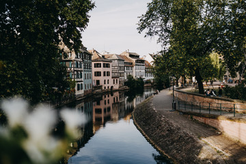 Fototapeta na wymiar river in strasbourg in the afternoon with houses in the background