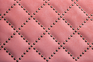 Naklejka premium leather texture with metal rivets. Use as background.