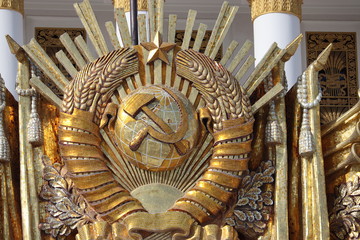 USSR coat of arms, communist and socialist symbol. Restored soviet emblem on facade of Central...