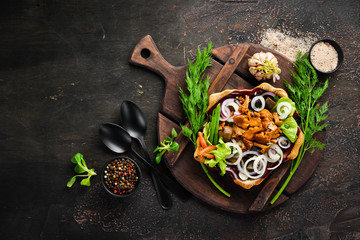 Marinated mushrooms with onions and spices in a plate. on rustic background, top view, banner.