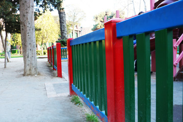 Colored wooden fence of the playground