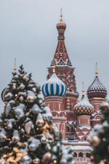 Blurred christmas trees in Red Square, Moscow. Christmas trees and background of St Basil Cathedral