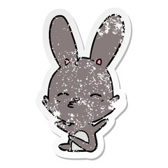 distressed sticker of a curious bunny cartoon