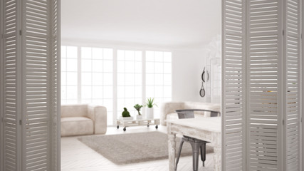 White folding door opening on modern scandinavian kitchen with island, stools and pendant lamps, cabinets and accessories, white interior design, designer concept, blur background