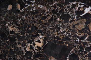 Beautiful brown marble with yellow streaks, called Emperador gold