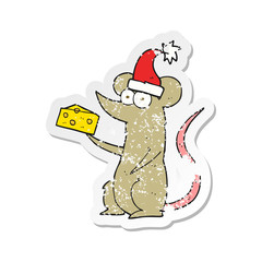 retro distressed sticker of a cartoon christmas mouse with cheese