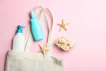 White beach eco bag, plastic bottles with sunscreen