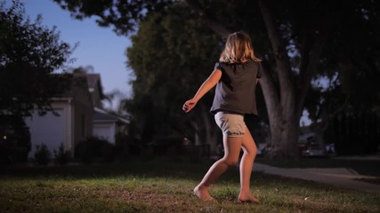 outdoors on suburban street at dusk. Slow motion, 4K UHD.