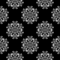 Floral seamless pattern. White design on black background