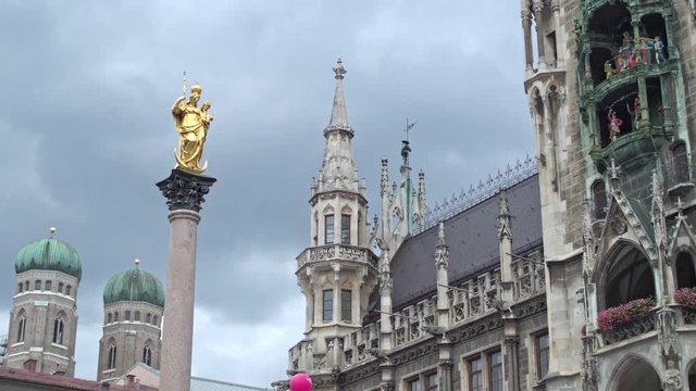The historic center of Munich, the beautiful building of the new city hall and the Golden statue of the virgin Mary.