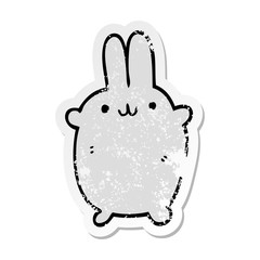 distressed sticker of a cartoon rabbit