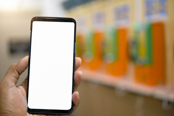 Man holding smart phone with bank mobile can be add your texts or others, public telephone background.