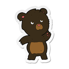 sticker of a cartoon curious black bear