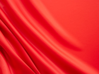 Fototapeta na wymiar Beautiful smooth elegant wavy hot red satin silk luxury cloth fabric texture, abstract background design. Wallpaper, banner or card with copy space.