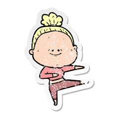distressed sticker of a cartoon happy old woman