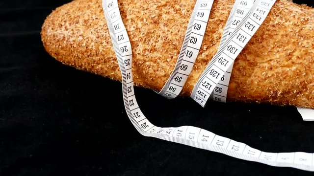 healthy bran bread and tape measure, whole wheat bread,