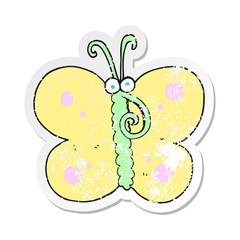 retro distressed sticker of a cartoon butterfly