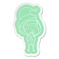 happy cartoon  sticker of a astronaut wearing santa hat