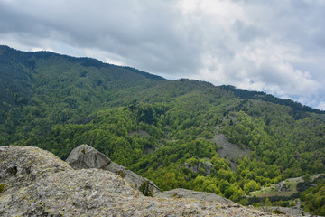 Spring landscape in Rhodope mountain, Bulgaria rainy puffy clouds 