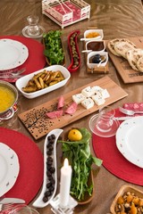 breakfast table with olives, cheese, jam  and turkish base