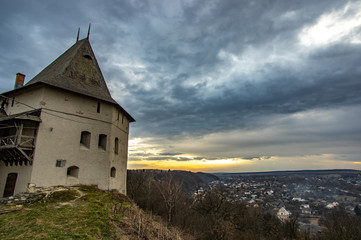 Tower of a medieval castle at sunset