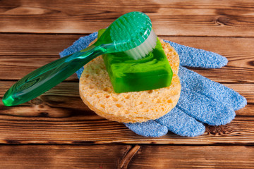 Objects for care of face skin: handmade natural soap, a sponge, the peeling brush and a massage...