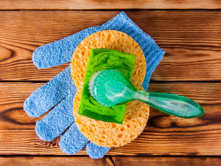 Objects for care of face skin: handmade natural soap, a sponge, the peeling brush and a massage...