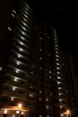 Fototapeta na wymiar multi-storey residential building in the dark
