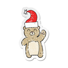 retro distressed sticker of a cartoon teddy bear waving