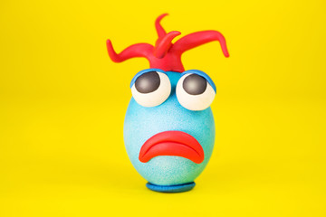 Easter Egg Cartoonish Character With Plasticine Eyes, Mouth and Hair Having an Expressive Face