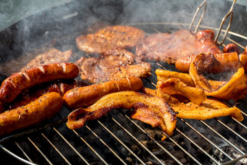 Unhealthy but tasty grilled sausages and meat