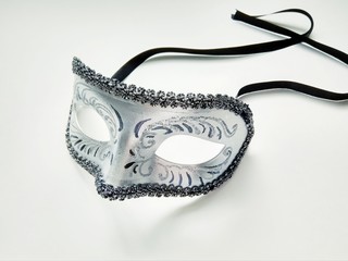 beautiful carnival silver mask with patterns on white background