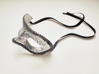 beautiful carnival silver mask with patterns on white background