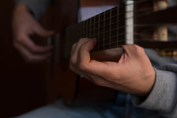 classic acustig guitar player performing, focus on hands