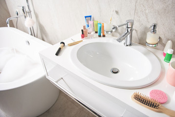 Top angle of white wash sink with items