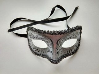 beautiful carnival silver mask with patterns on white background