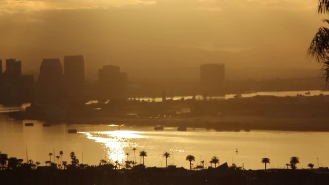 Here is a uniquely colored essence shot as the sun rises over the city of San Diego, CA illuminating the bay with gold color.