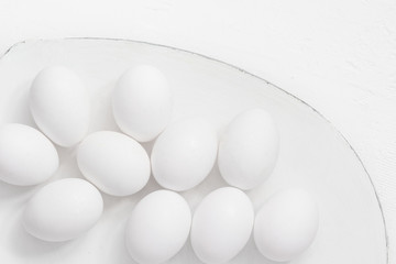 Easter background White eggs platter