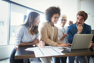 Creative business people working on business project in office