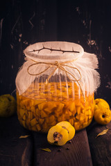 Sliced fruit quince jar covered sugar