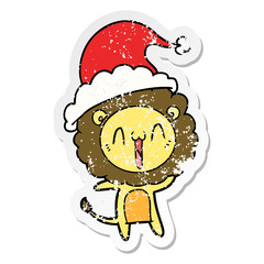 happy distressed sticker cartoon of a lion wearing santa hat