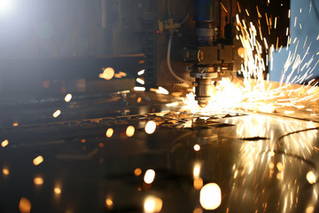 Sparks fly out machine head for metal processing