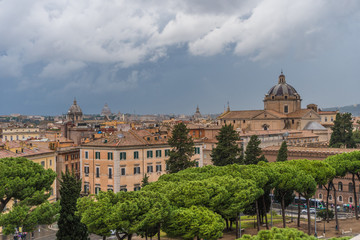 Fototapeta na wymiar View above downtown of Rome, Italy. Beautiful city view beafore rain
