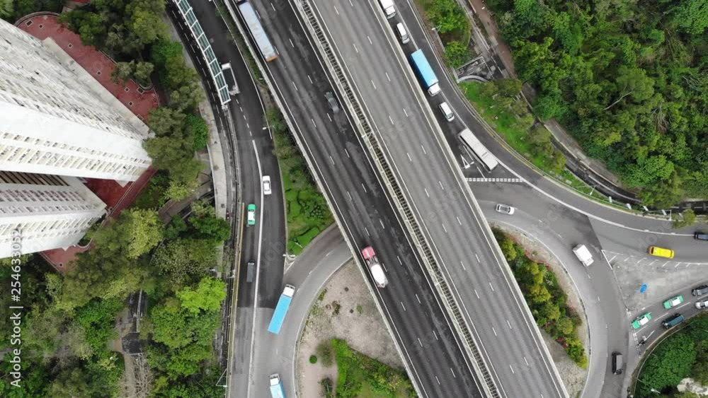 Aufkleber aerial view and pan shot of traffic on 3-way stop street intersection circle roundabout in hong kong