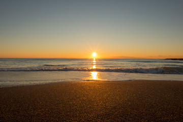 Naklejka premium Sunrise on a beach in Denia, Alicante