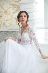 Portrait of a beautiful elegant bride  in a bright interior.