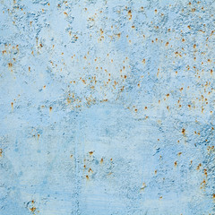 Square texture of old rusting metal plate painted in light blue