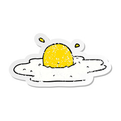 distressed sticker of a cartoon fried egg